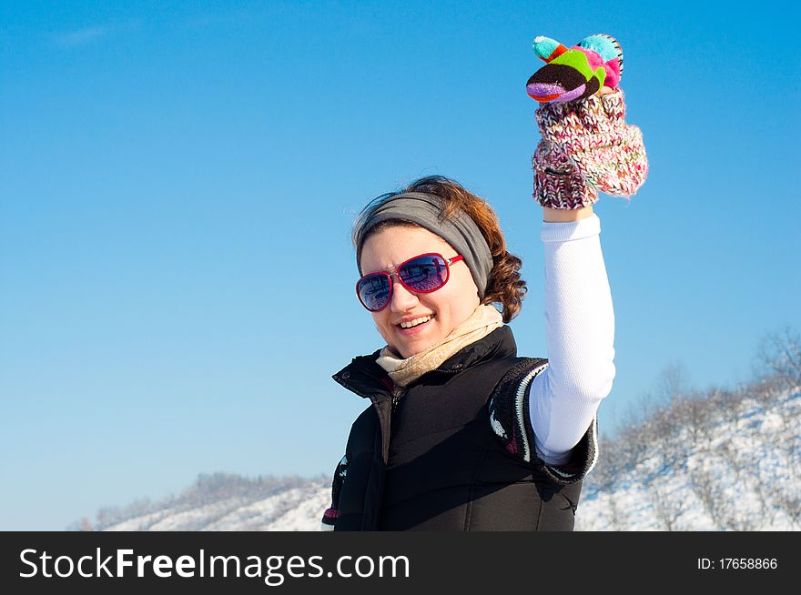 Young woman with red sunglasse in an outdoor winter setting. Young woman with red sunglasse in an outdoor winter setting