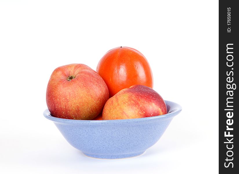 Still life with red apples and persimmons, on a white background