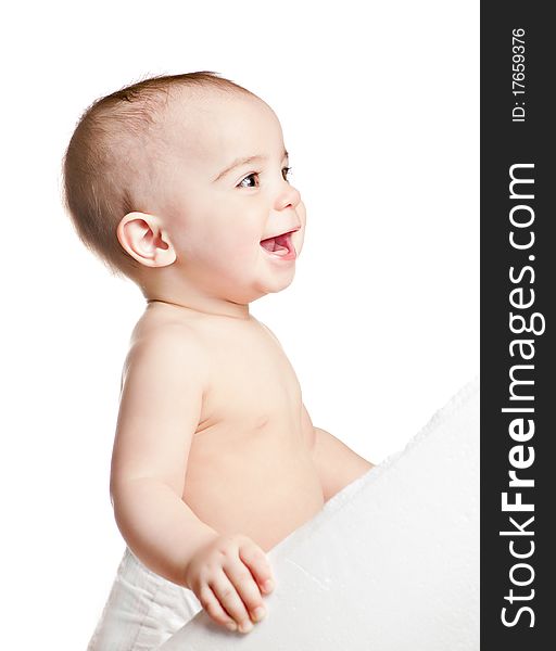 Small beautiful laughing baby girl on a white background