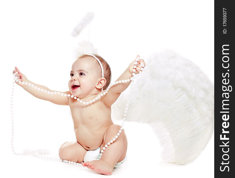 Baby girl in a angel fancy dress on a white background