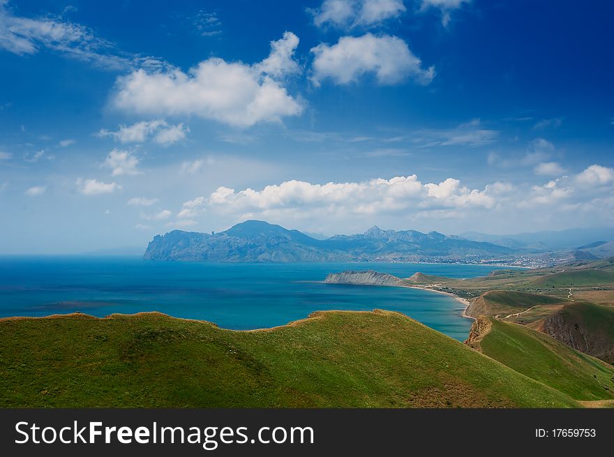 Summer day landscape with the sea and mountains. Ukraine, Republic of Crimea. Summer day landscape with the sea and mountains. Ukraine, Republic of Crimea