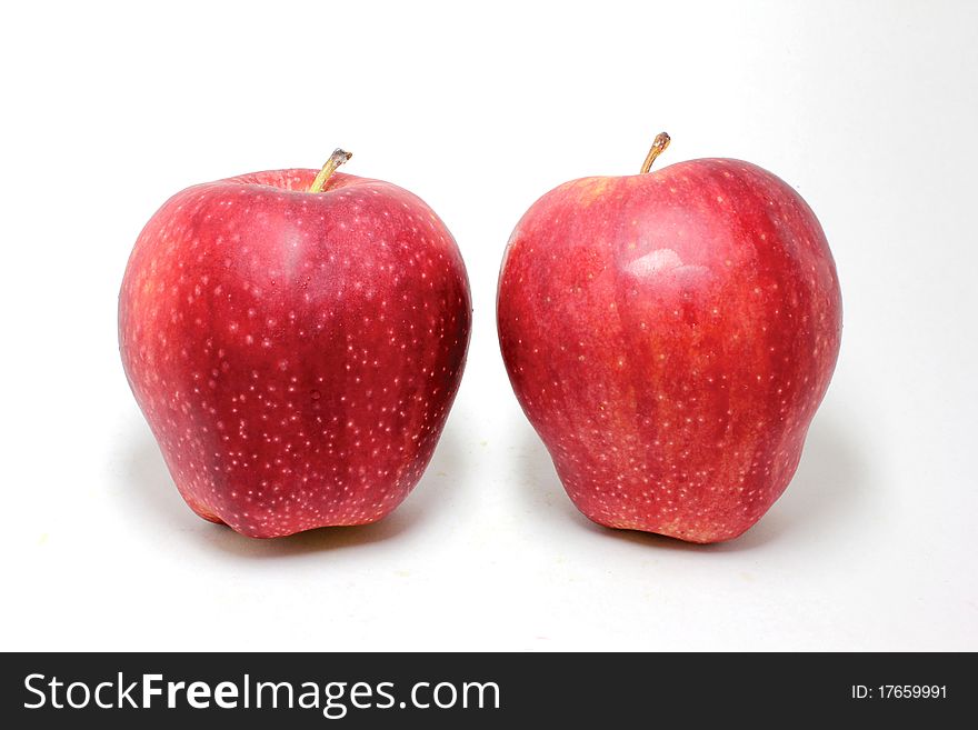 A pair of red fresh apples. A pair of red fresh apples