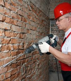 House-builder In Uniform Working Royalty Free Stock Photo House-builder In Uniform Working Royalty Free Stock Photo