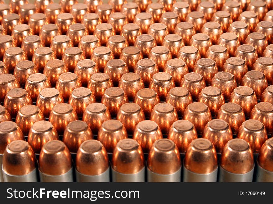 Rows of 40 caliber pistol bullets. Rows of 40 caliber pistol bullets.