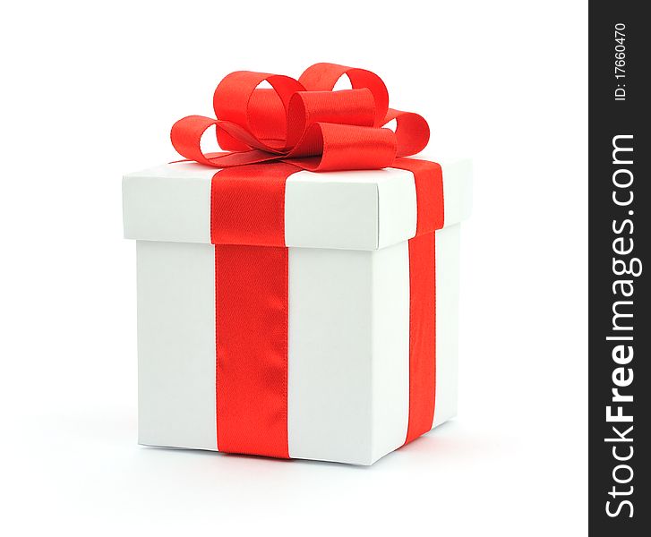 White gift box with a red bow on white background. White gift box with a red bow on white background