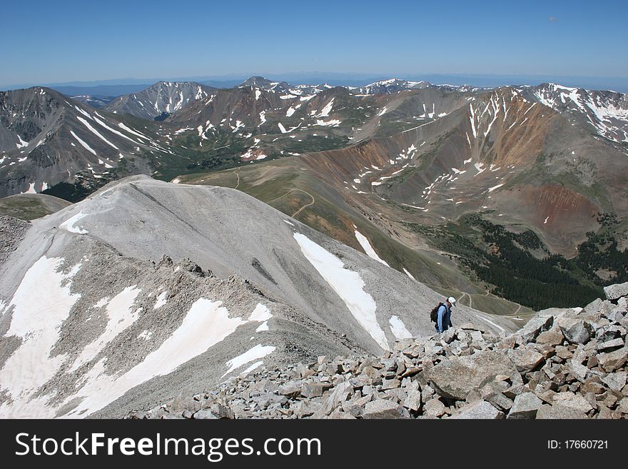 A hiker ascending Mt. Antero, a Colorado fourteener. A hiker ascending Mt. Antero, a Colorado fourteener.