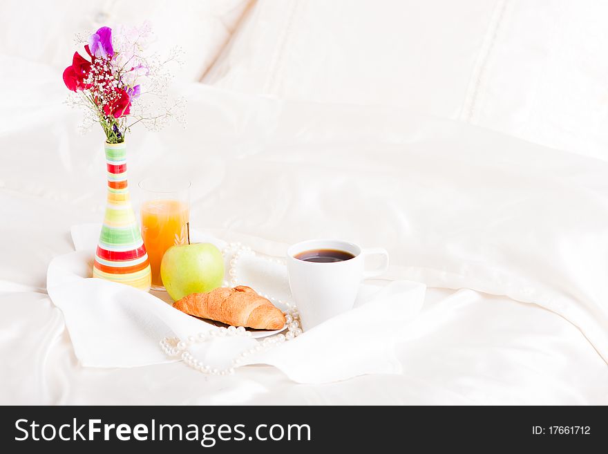 Cup of coffe and flower in vase on tray. Cup of coffe and flower in vase on tray