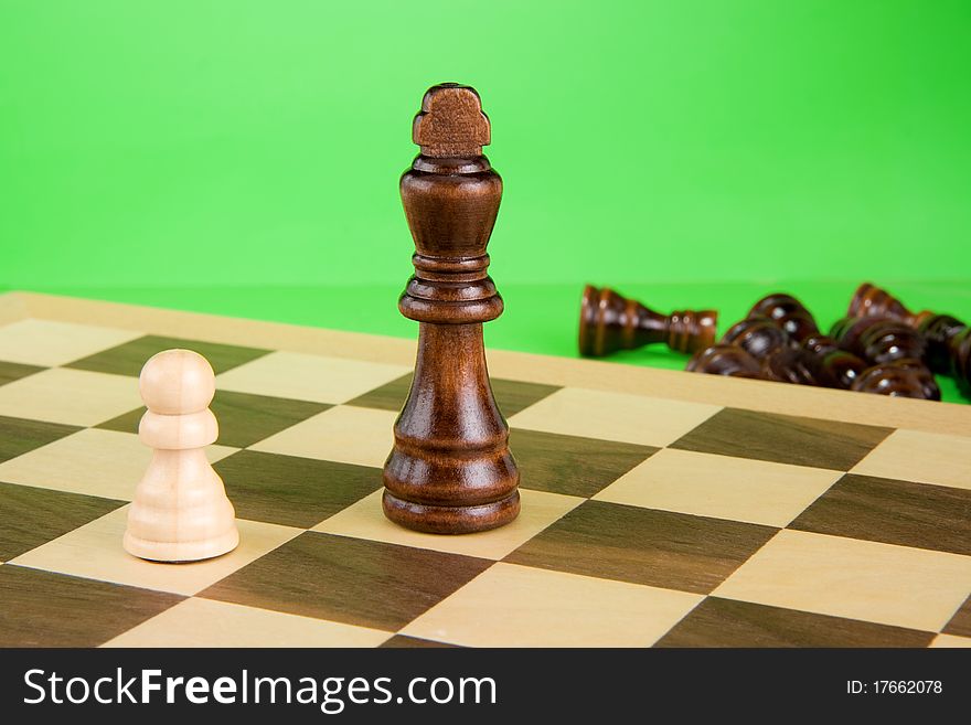 Chess piece isolated on green background. Chess piece isolated on green background