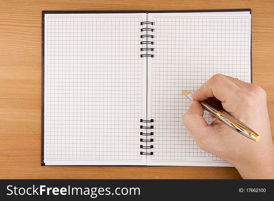 Hand writing by pen on checked notebook. Hand writing by pen on checked notebook