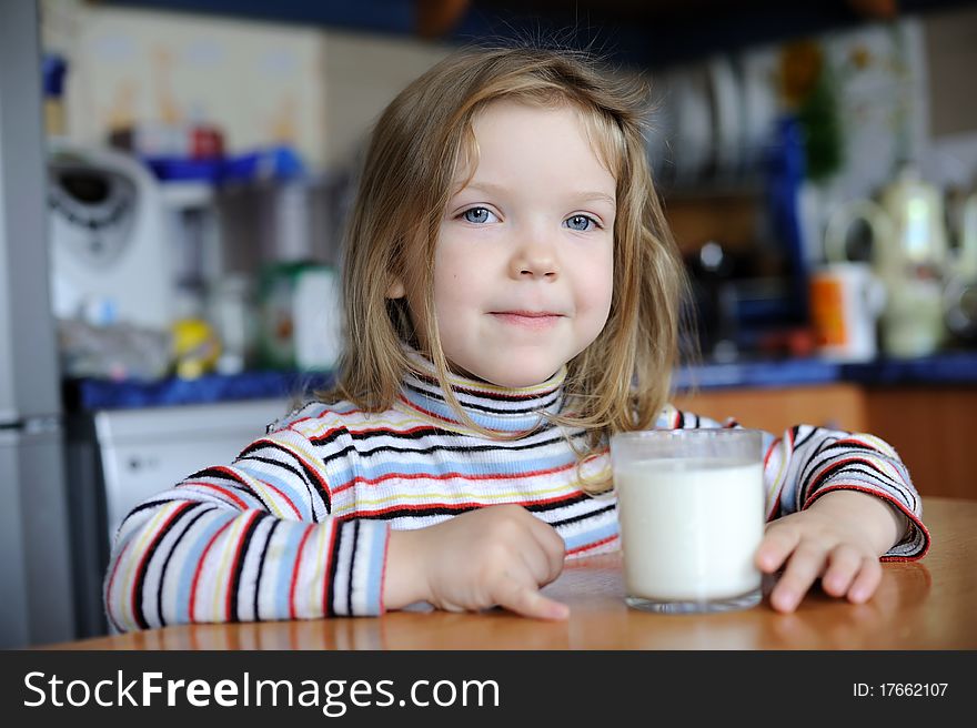 A girl with a glass of milk