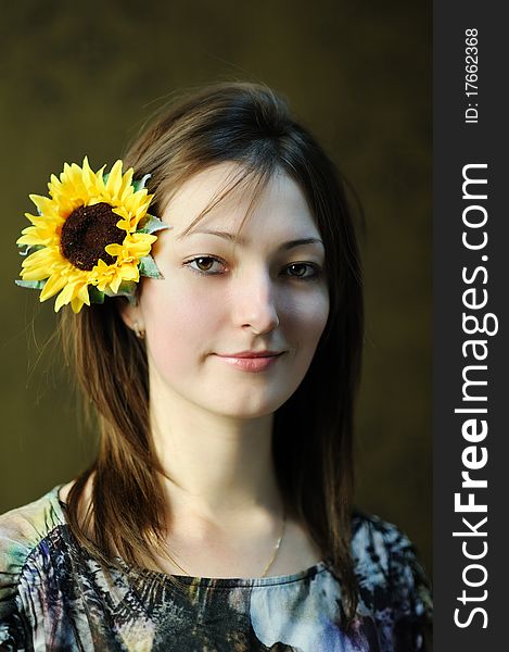 A beautiful woman with sunflower in her hair