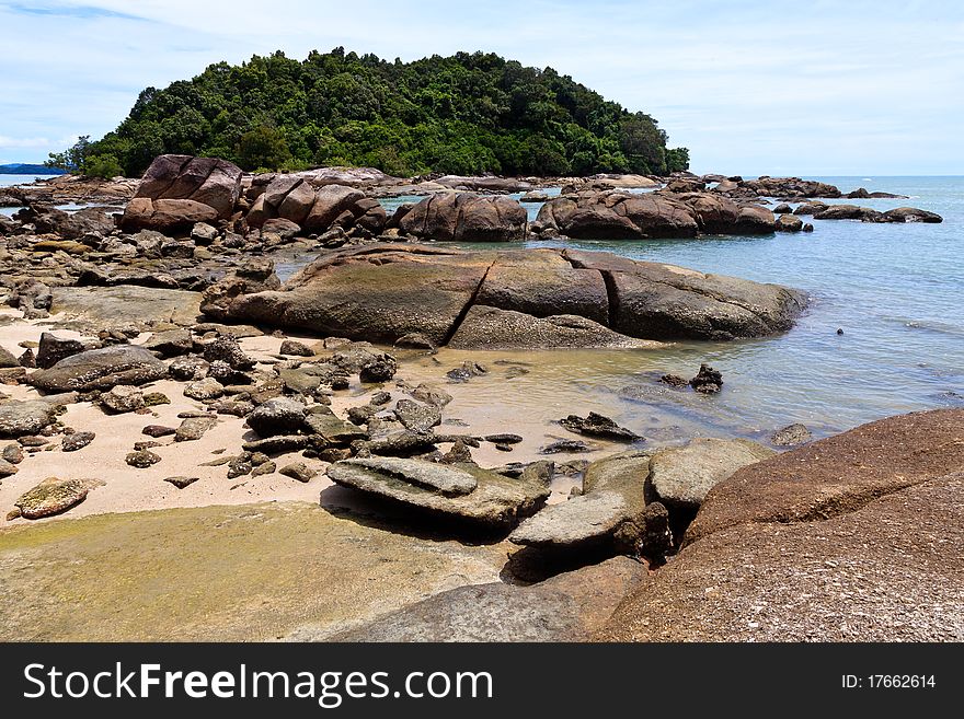 Tropical rocky beach with rain forest in Malaysia