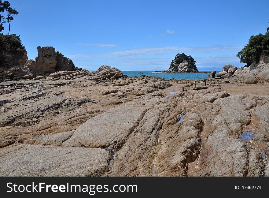 A rock formations and islands at Little Kaiteriteri Beach, Abel Tasman National Park, New Zealand. A rock formations and islands at Little Kaiteriteri Beach, Abel Tasman National Park, New Zealand.