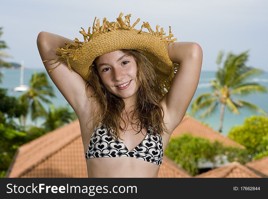 Happy teenager in front of a holiday resort