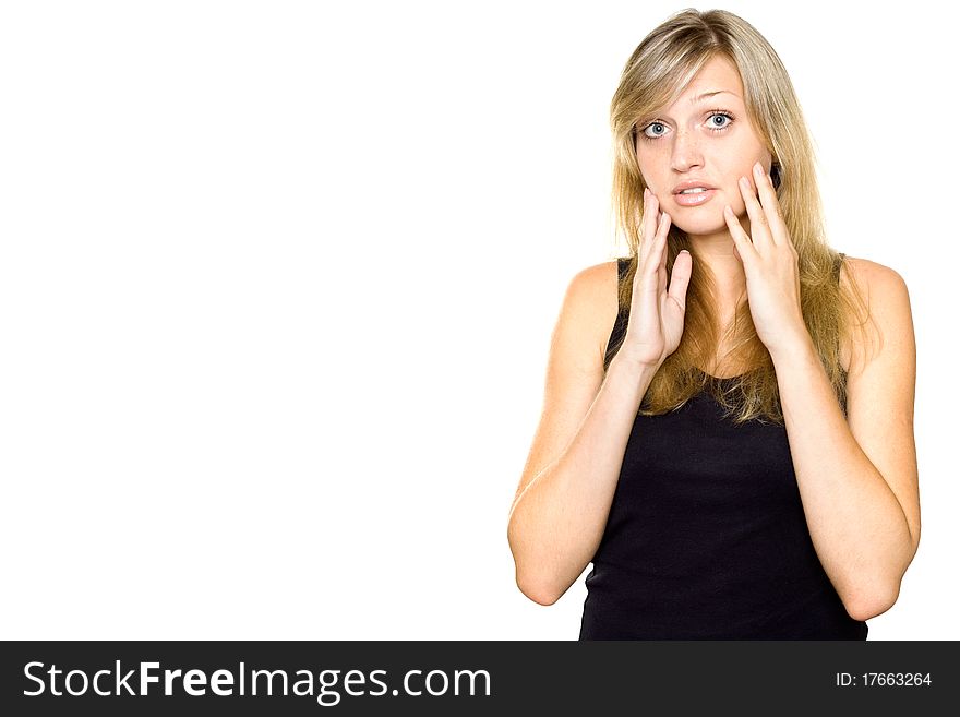 Close-up of a young woman looking surprised. Hands on cheeks. Lots of copyspace and room for text on this isolate. Close-up of a young woman looking surprised. Hands on cheeks. Lots of copyspace and room for text on this isolate