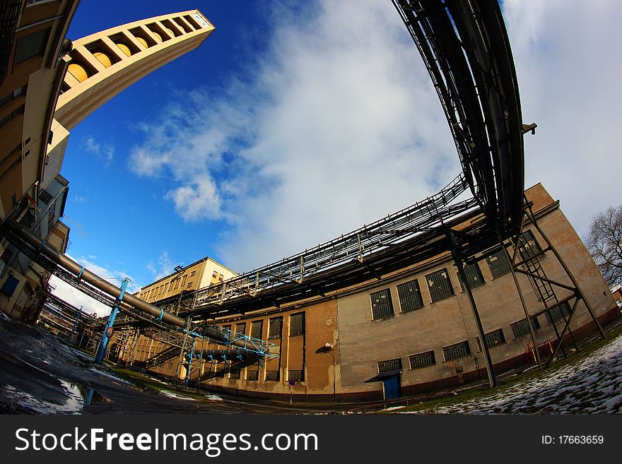 Old chemical industrial complex with chimney. Fisheye view. Old chemical industrial complex with chimney. Fisheye view