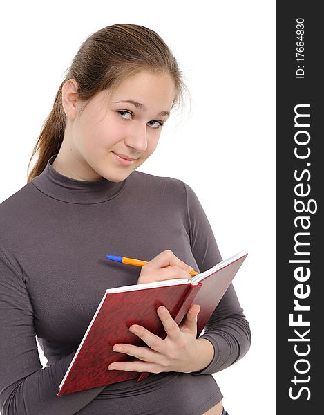 Young woman with a notebook on a white background