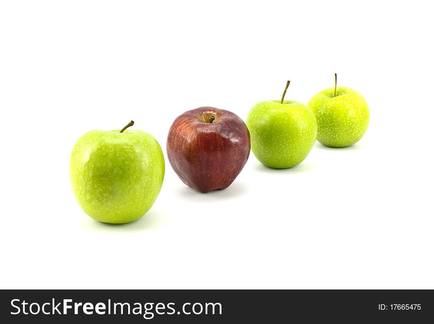 Green apple with the red one standing isolated on white background