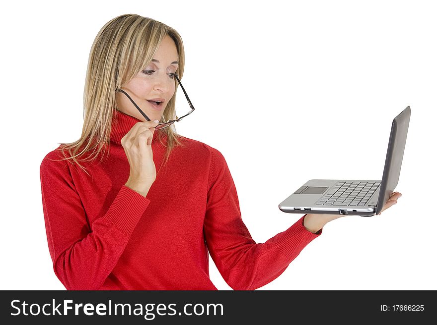 Happy working woman sitting on the floor with her laptop