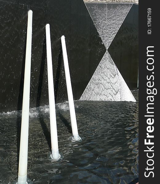 Pyramid art reflecting in a water pool