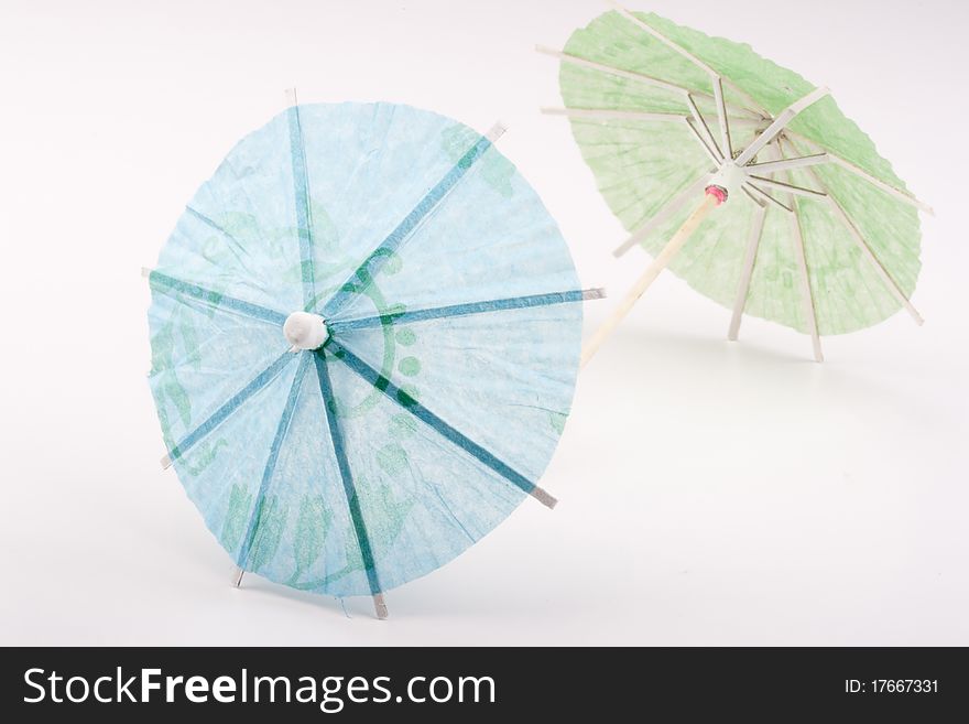 Paper umbrellas to decorate the glasses with a cocktail.