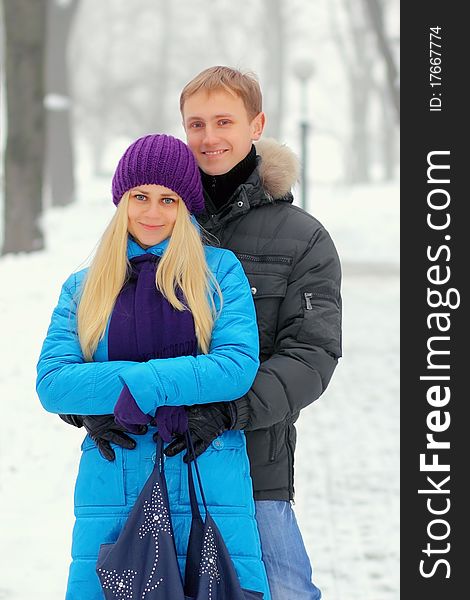 Young adult couple in the park. Winter.