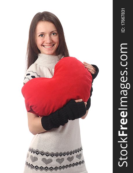 Happy fashionable young woman holding red Valentine's heart and smiling; isolated on white. Happy fashionable young woman holding red Valentine's heart and smiling; isolated on white