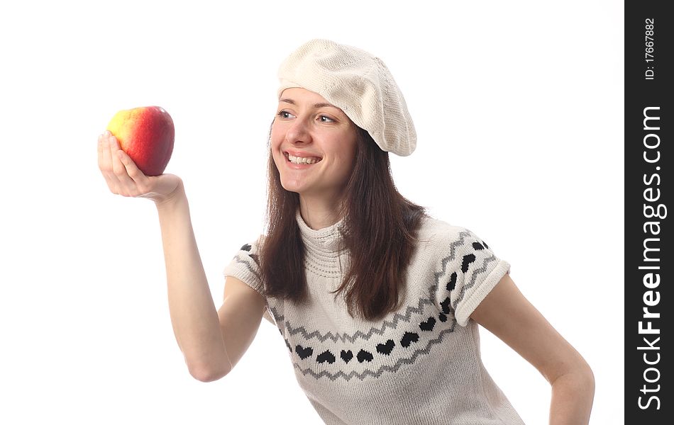 Happy young woman looking at juicy red apple; isolated on white