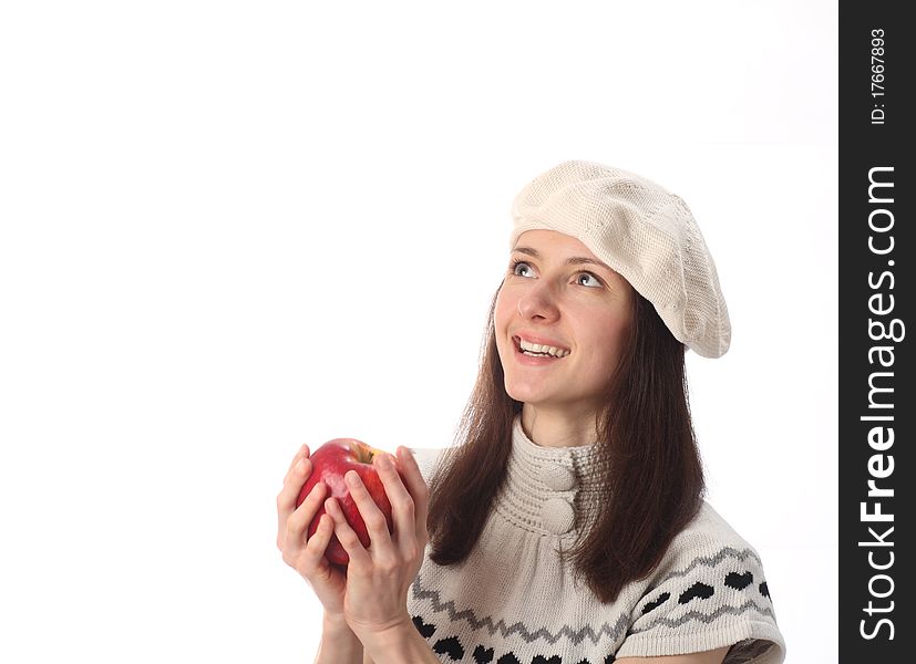 Happy beautiful young woman holding red apple