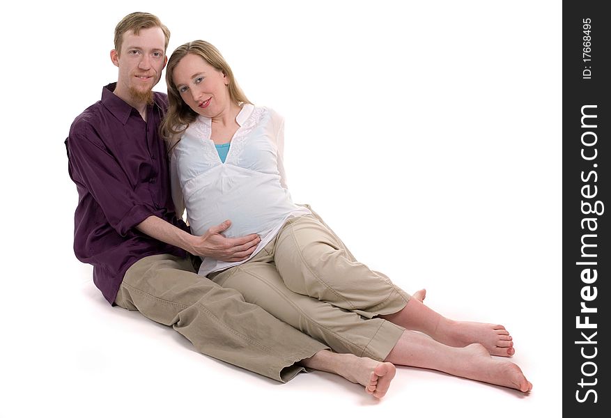 A young couple pregnant with their first child.