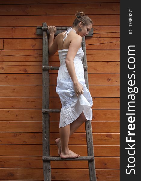 Girl On A Wooden Step-ladder