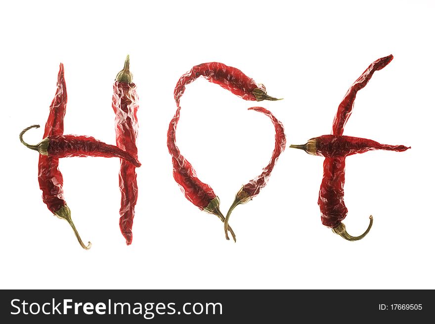 Red hot chilli peppers spelling the word hot on white background. Red hot chilli peppers spelling the word hot on white background