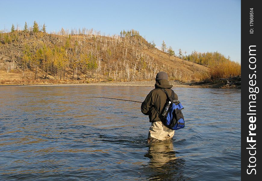 Fishing - fisherman catch fishes on river