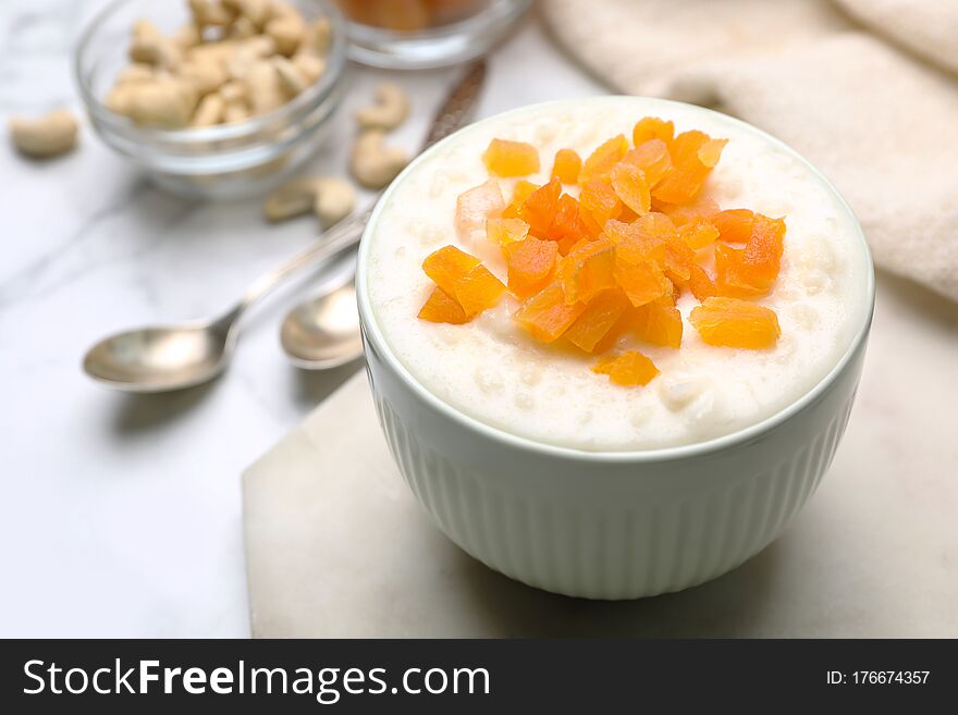 Delicious Rice Pudding With Dried Apricots On Table