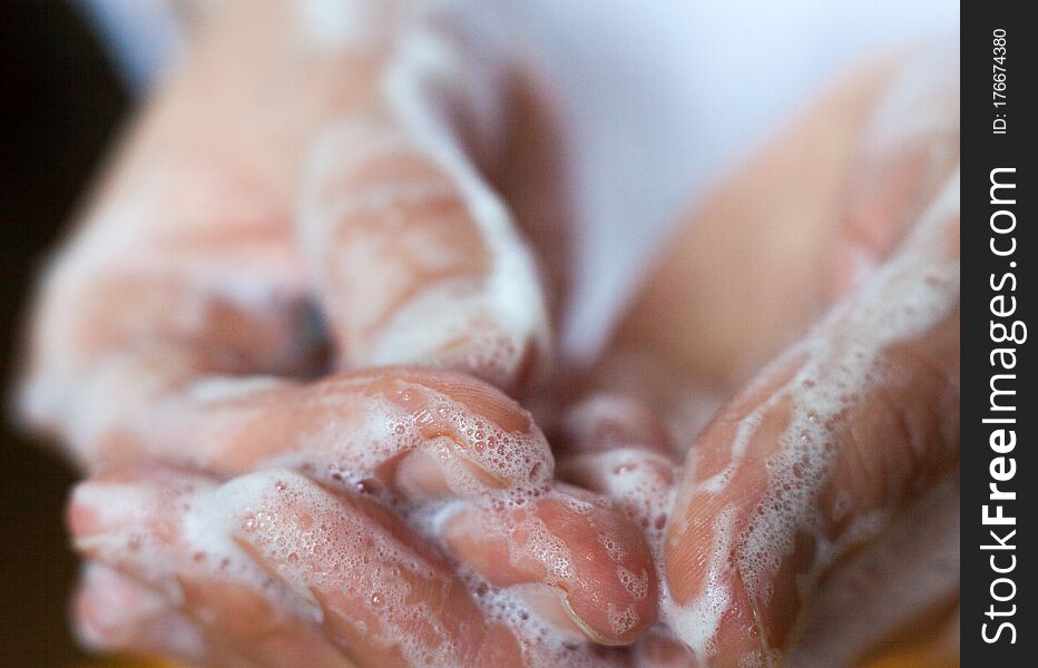 Washing hands. Rubbing with a soap. Close-up. Hand hygiene to reduce the spread of infections. Handwashing to stop spreading coronavirus and other infections