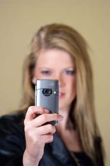 Girl Taking A Photo With Her Mobile Phone Stock Photography