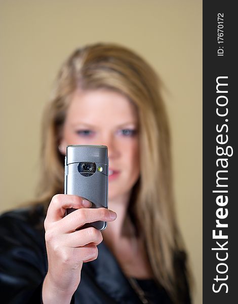 Girl taking a photo with her mobile phone