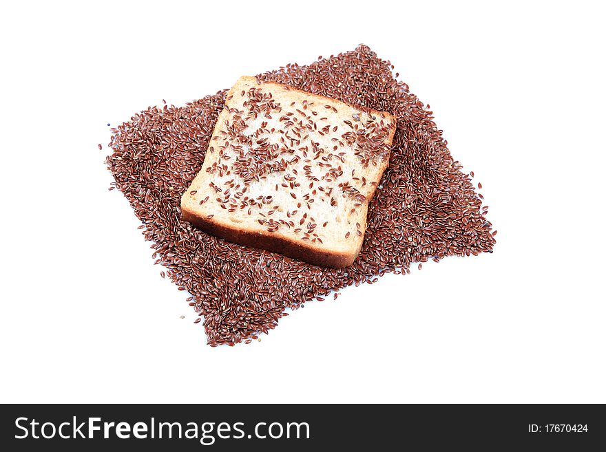 Fibrous food brown bread slice with roassted flax seeds isolated on white background.