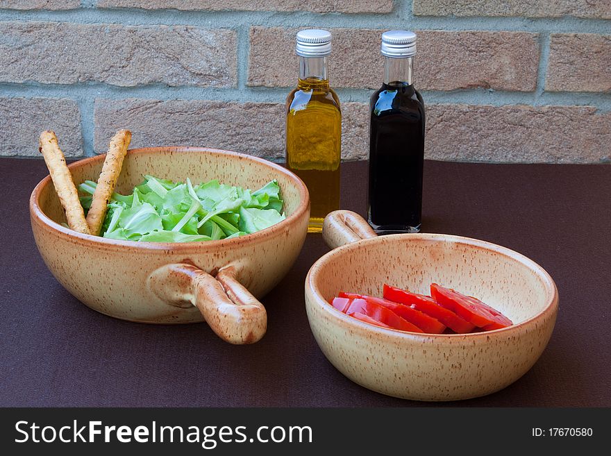 Salad, tomato, oil and vinegar. Salad, tomato, oil and vinegar