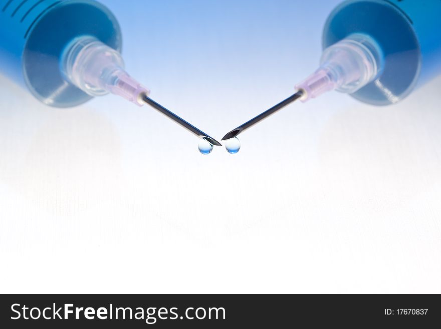 Blue medication with colorful background. Lit from below, blended blue-colored background.