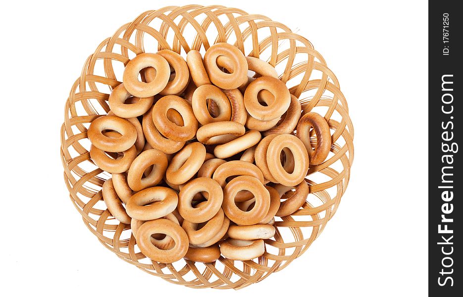 A heap of ring-shaped bread in the basket. A heap of ring-shaped bread in the basket