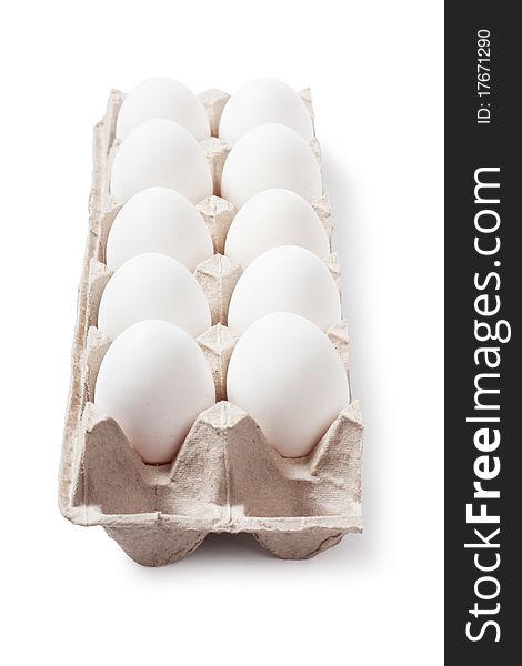 White eggs in carton. Nutritious eating.