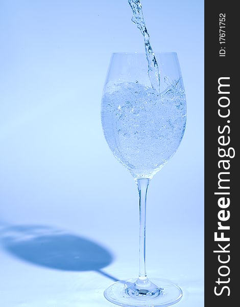 Glass of water isoladed on blue