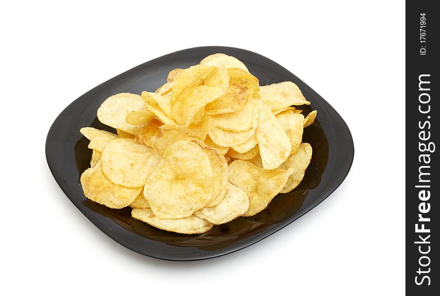 Chips in black dish isolated on white background