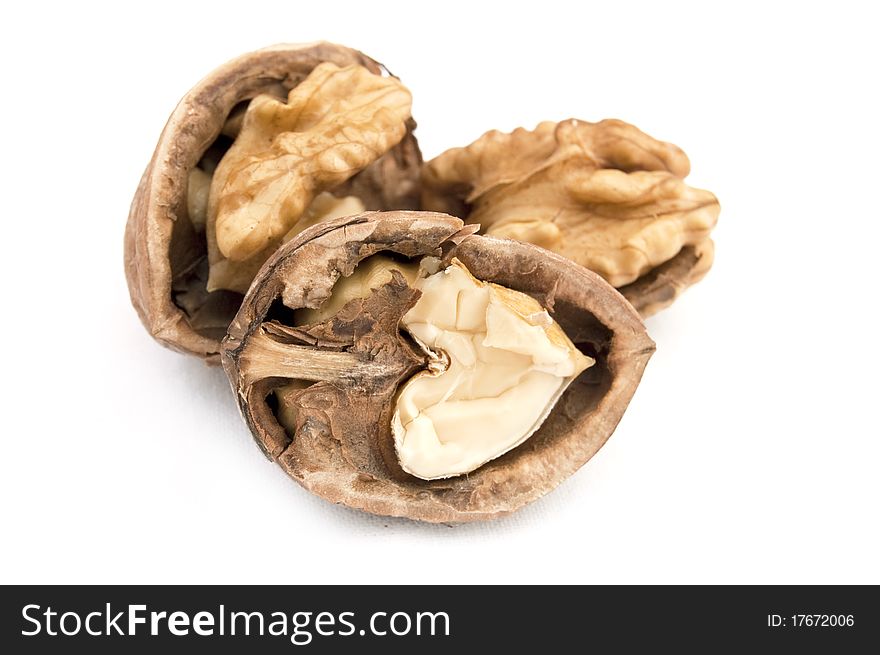 Walnut and a cracked walnut isolated on the white background