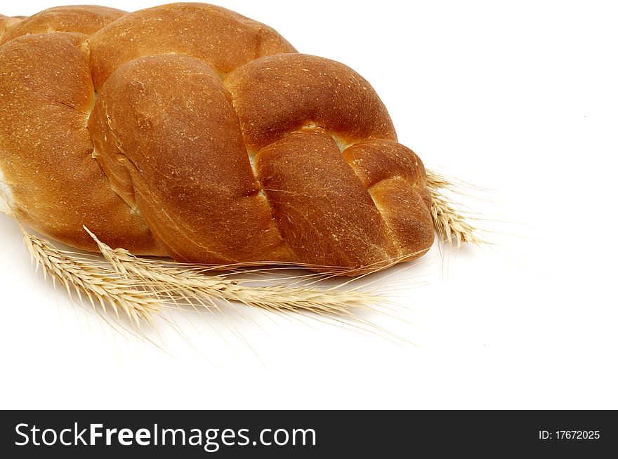 A pigtail on white bread isolated on white background