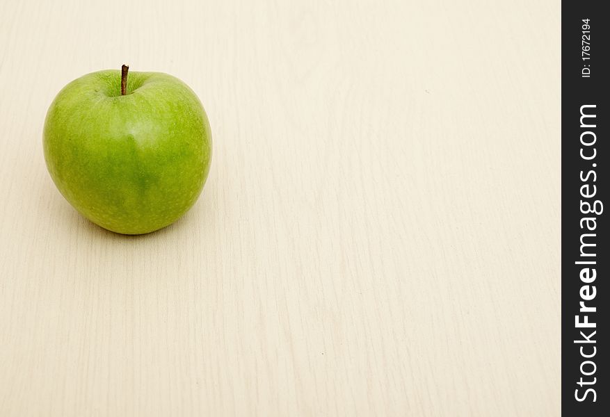 Green Apple On Wooden Table