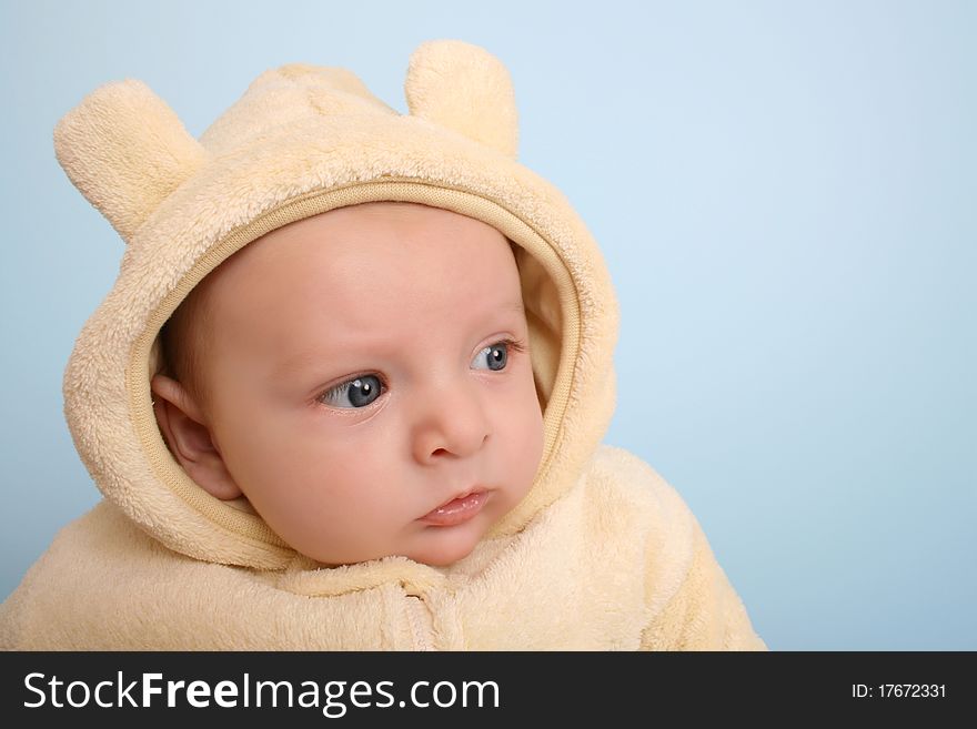 Two month old baby boy wearing a soft animal suit