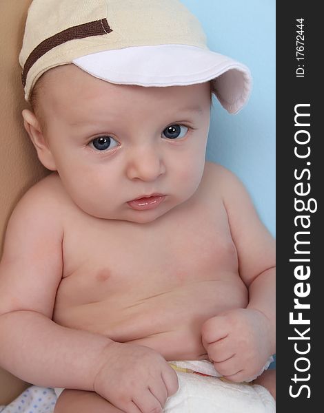 Ten week old baby boy wearing a hat