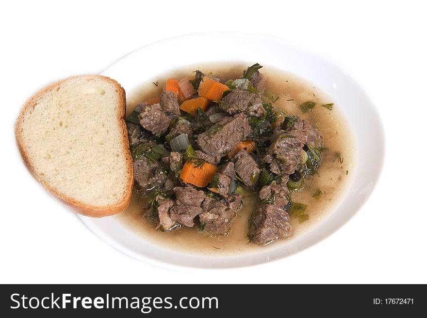 Meat soup on a white plate